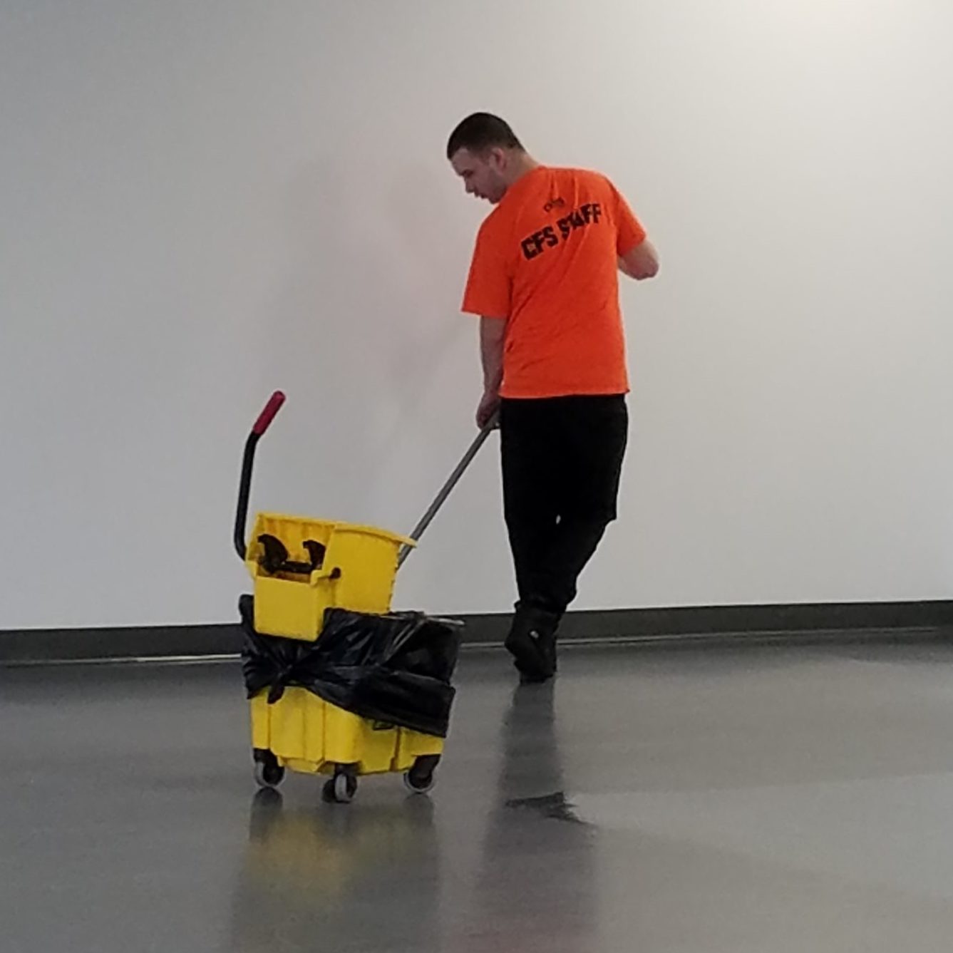 Cummins Facility Services Team: Employee Cleaning Floor