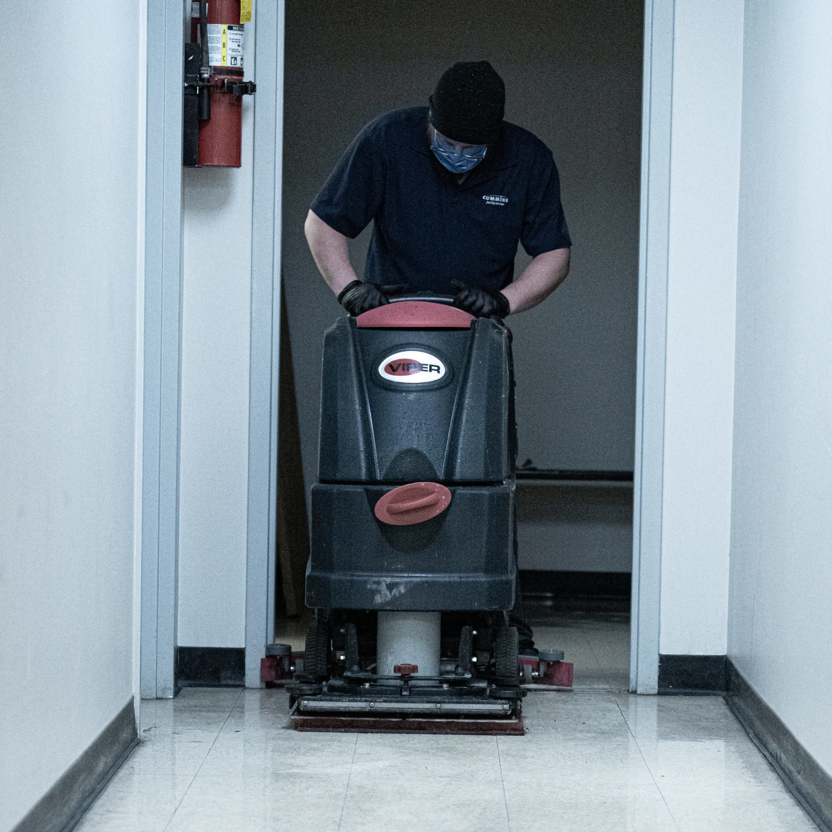 Cummins Facility Services Team: Employee Cleaning Floor